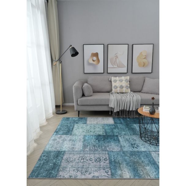 Denne produkten heter Vero Flora, laget av Polyester materiale med en vakker Blå farge – SE Mattor